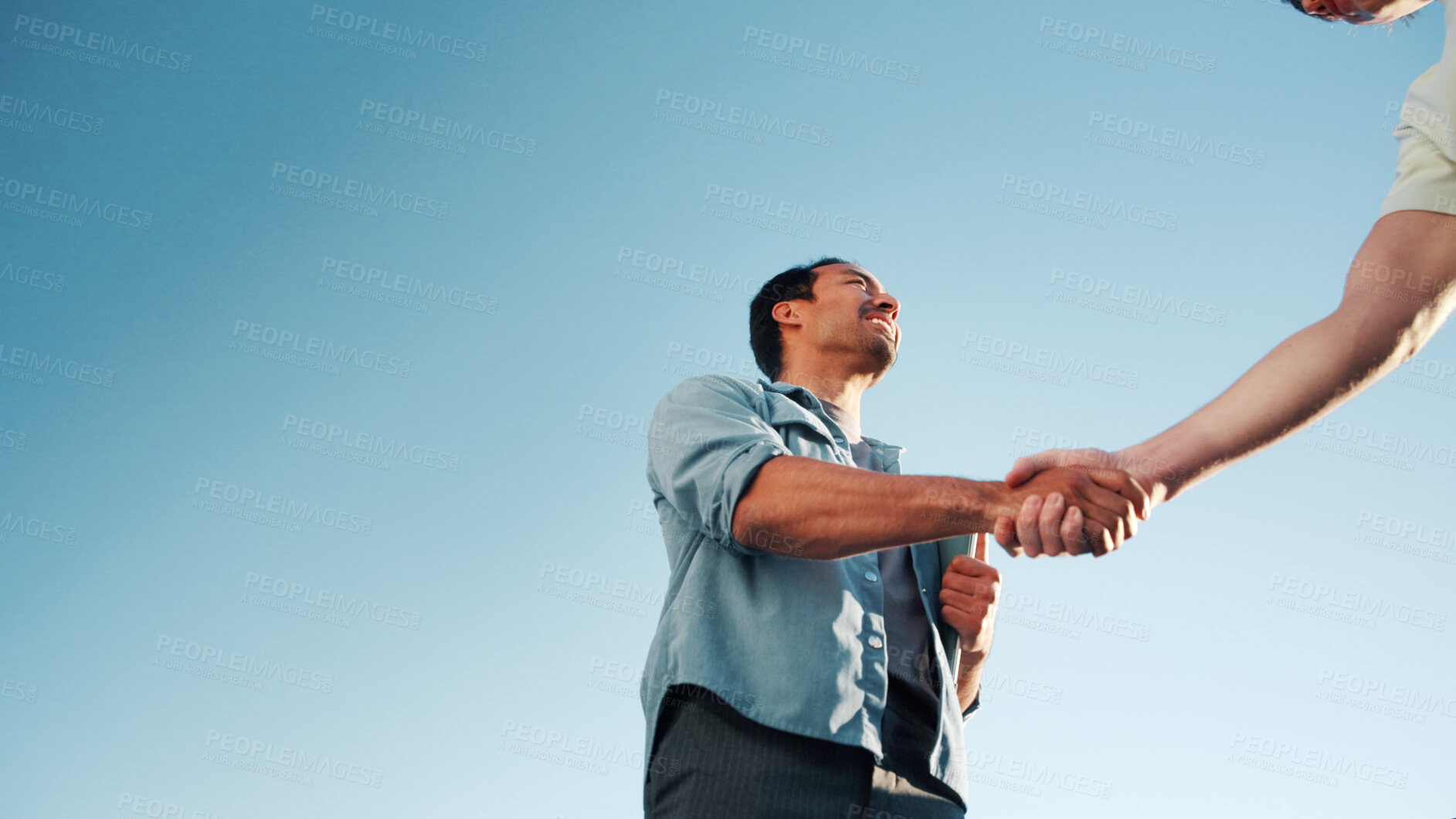 Buy stock photo Handshake, below and business people outdoor for deal, partnership and finance negotiation. Space, corporate and financial manager shaking hands with client for investment contract by blue sky.