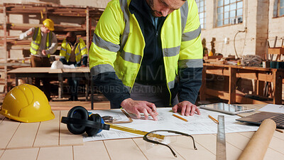 Buy stock photo Carpentry, man and blueprint review in workshop for shopfitting, custom furniture design and staff. Tech, carpenter and floor plan in warehouse for woodwork project, cabinetry layout and evaluation