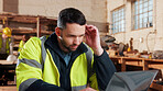 Thinking, laptop and man in workshop for construction contract, material supplier and carpentry. Thoughtful, computer and person with inventory list, timber stock and planning for infrastructure