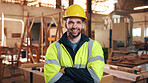 Portrait, carpenter and man in workshop with confidence for manufacturing, about us or protection gear. Smile, woodwork and artisan with helmet for safety, pride or arms folded in production industry