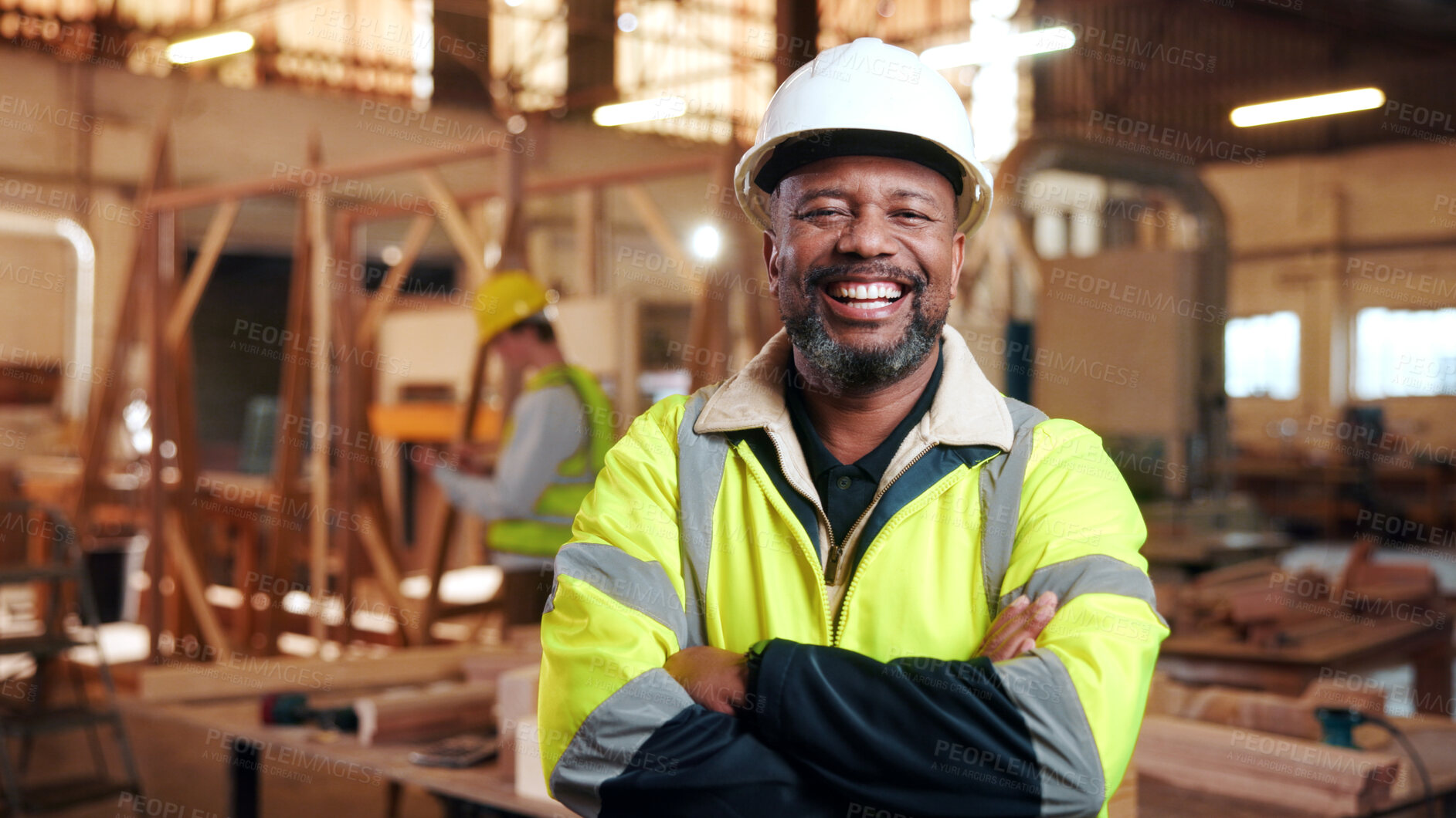 Buy stock photo Laugh, carpenter and man in workshop with arms crossed for manufacturing with protection gear. Smile, woodwork and mature artisan with safety helmet, portrait or confident in production industry