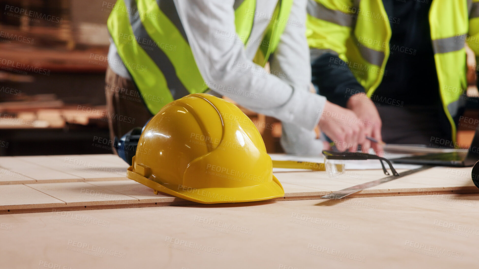 Buy stock photo Helmet, hands and team with meeting in carpentry for shopfitting project, design review and ppe. Carpenter, hardhat and people with discussion in workshop for custom furniture, planning and woodwork
