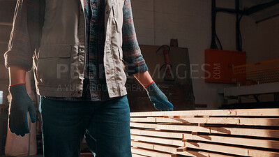 Buy stock photo Carpentry, wood and hands of man in workshop for inspection, quality assurance and timber. Walking, carpenter and person with planks for manufacturing, lumber production and woodworking for furniture
