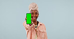 Happy, portrait and black woman with phone green screen for marketing on a studio background. Female person, user or smile with mobile smartphone display for UX, UI or advertising app on mockup space
