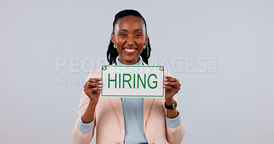 Buy stock photo Happy, portrait or hiring sign with black woman in studio for job recruitment on a white background. Female person, employer or recruiter with smile or poster for career opportunity or onboarding