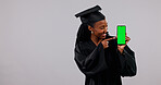 Student, phone and black woman with green screen for graduation app on a white background. Female person, graduate or pointing with smile, technology display or UI for qualification on mockup space