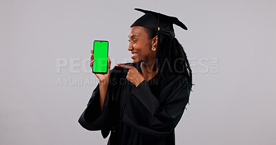 Buy stock photo Graduation, phone and black woman with green screen for student app on a white background. Female person, graduate or pointing with smile, technology display or UI for qualification on mockup space