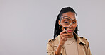 Portrait, woman and detective in studio with magnifying glass, crime investigation and mockup space. Private investigator, black person and tools for inspection, search and find on white background.