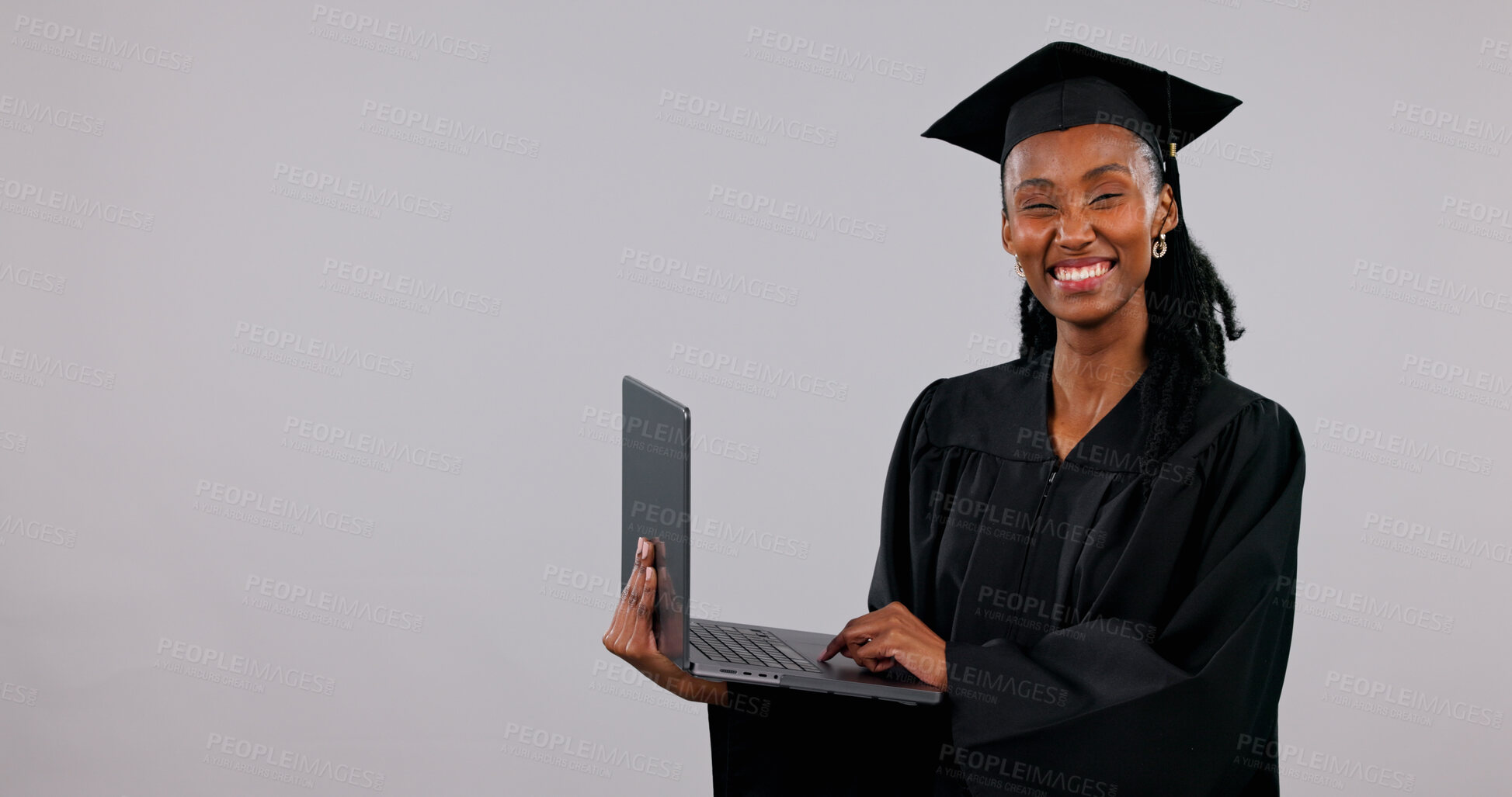 Buy stock photo Graduation, laptop and portrait of black woman in studio for education announcement or information. Computer, space and university sign up with happy student on white background for online course