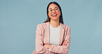 Arms folded, laugh and woman in studio for business, tax consultant or career growth on blue background. Portrait, financial worker and happy person with confidence, VAT specialist and mockup space
