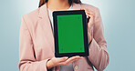 Tablet, woman and hands with green screen for marketing mockup on a blue studio background. Female person, employee or presentation with technology display for advertising or app review on space