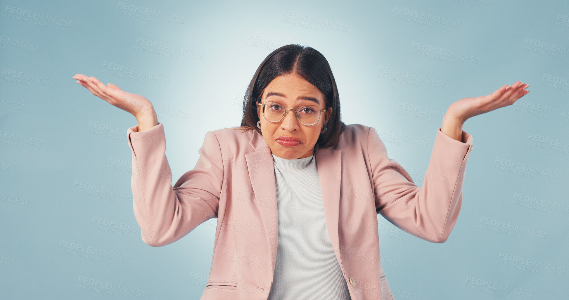 Buy stock photo Confused, woman and shrug in studio for business choice, decision or blue background. Doubt, portrait and female person with dont know gesture with question, unsure or puzzled with options comparison