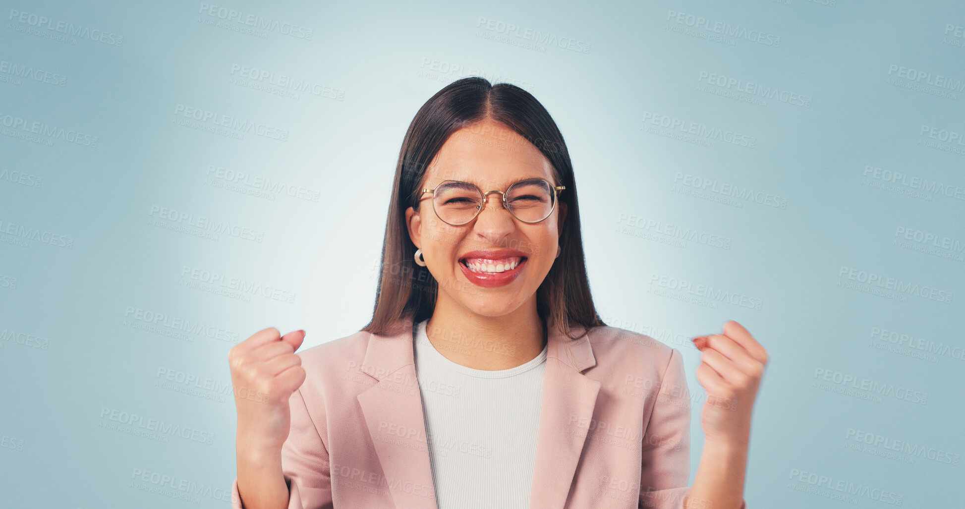 Buy stock photo Portrait, winning and happy woman with fist pump in studio for celebration on a blue background. Excited, female person or winner with smile or good news for business success, achievement or bonus