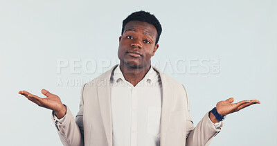 Buy stock photo Choice, man and shrug in studio for business, decision and confused with options comparison on background. Doubt, portrait and African person with dont know gesture, unsure worker and puzzled
