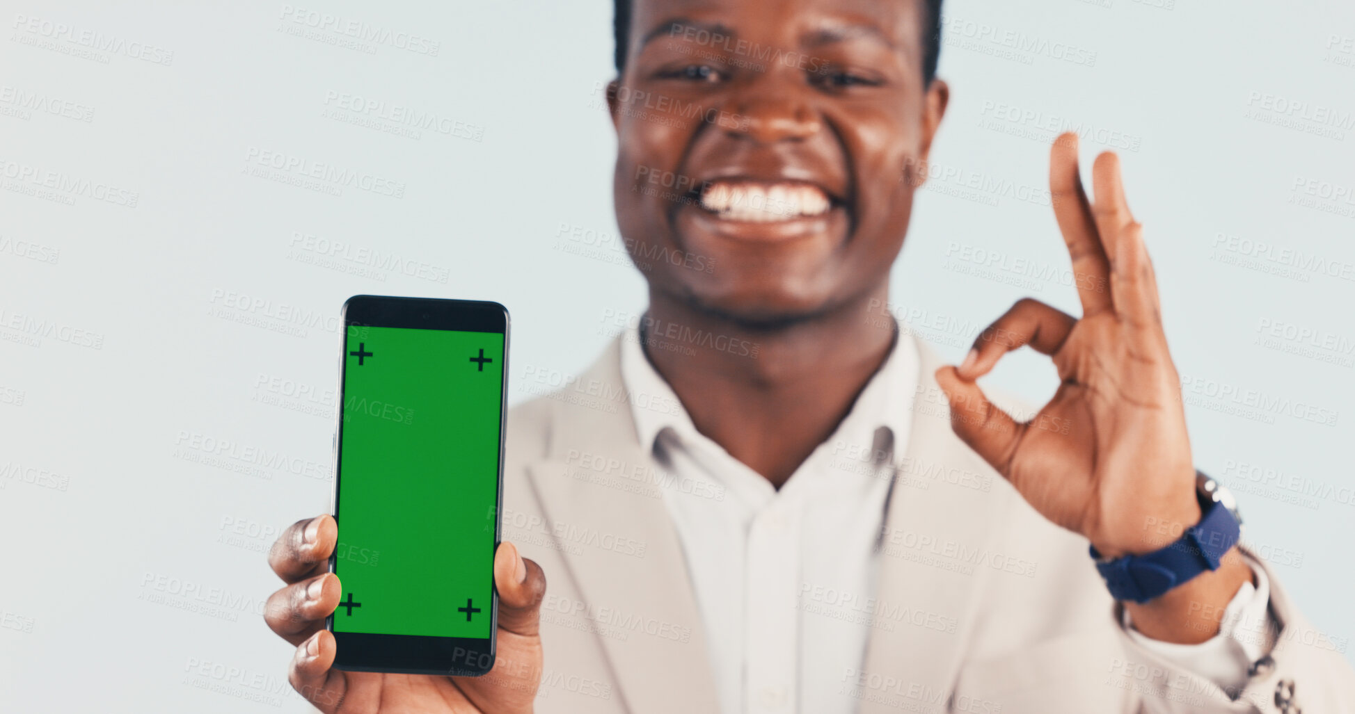 Buy stock photo Portrait, phone and black man with green screen in studio for perfect app on a white background. Happy, businessman and smile with mobile smartphone display, ok sign or emoji for perfection on mockup