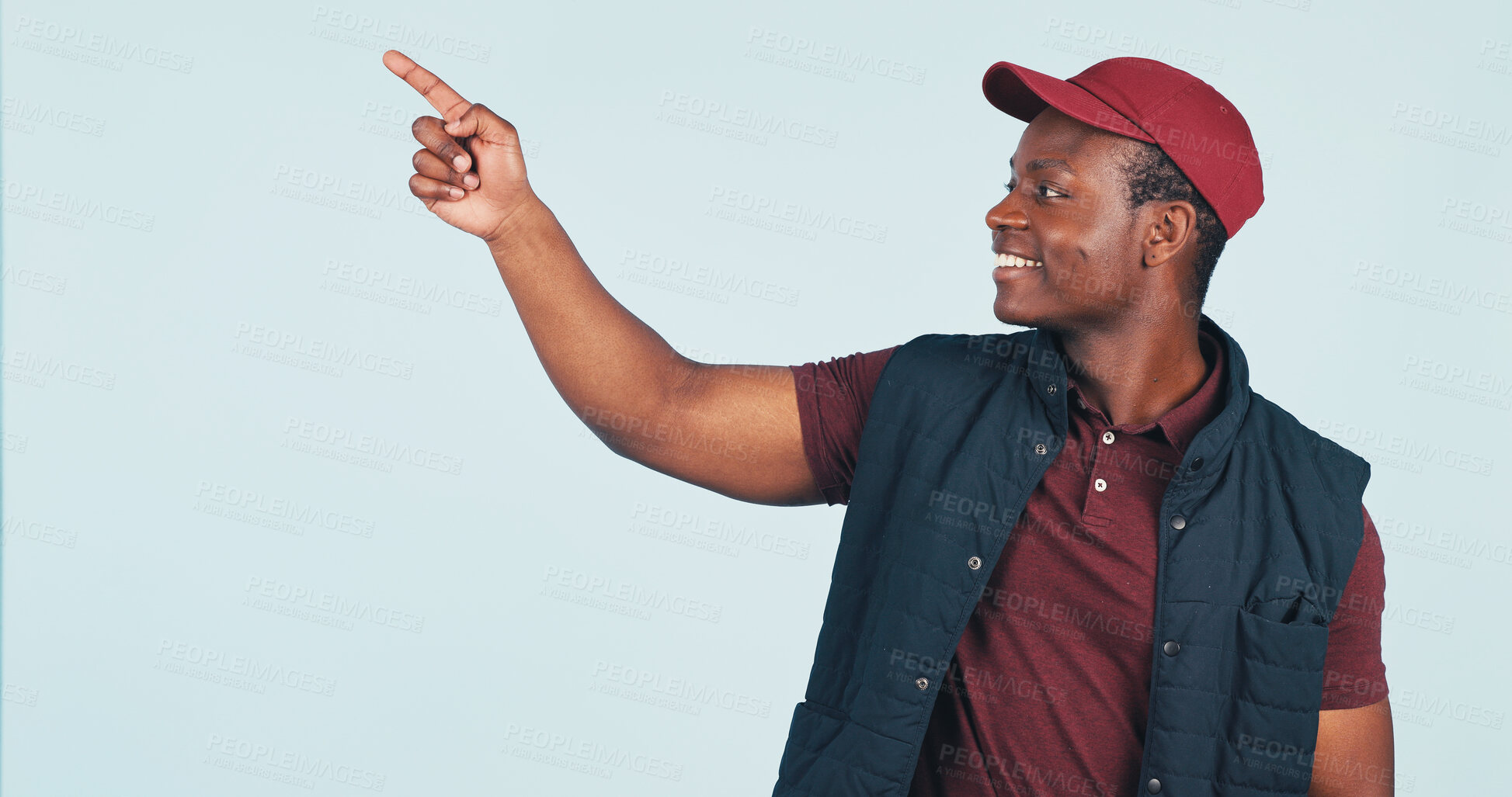 Buy stock photo Pointing, space and delivery man in studio for ecommerce news, advertising and shipping info. Mockup, happy and African person with gesture for logistics, courier service or promo on white background