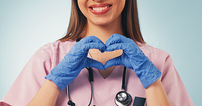 Buy stock photo Woman, doctor or happy with heart hands in health for medical support, pediatric care or trust. Pediatrician, person and gloves with love emoji on studio background for safety, integrity or assurance