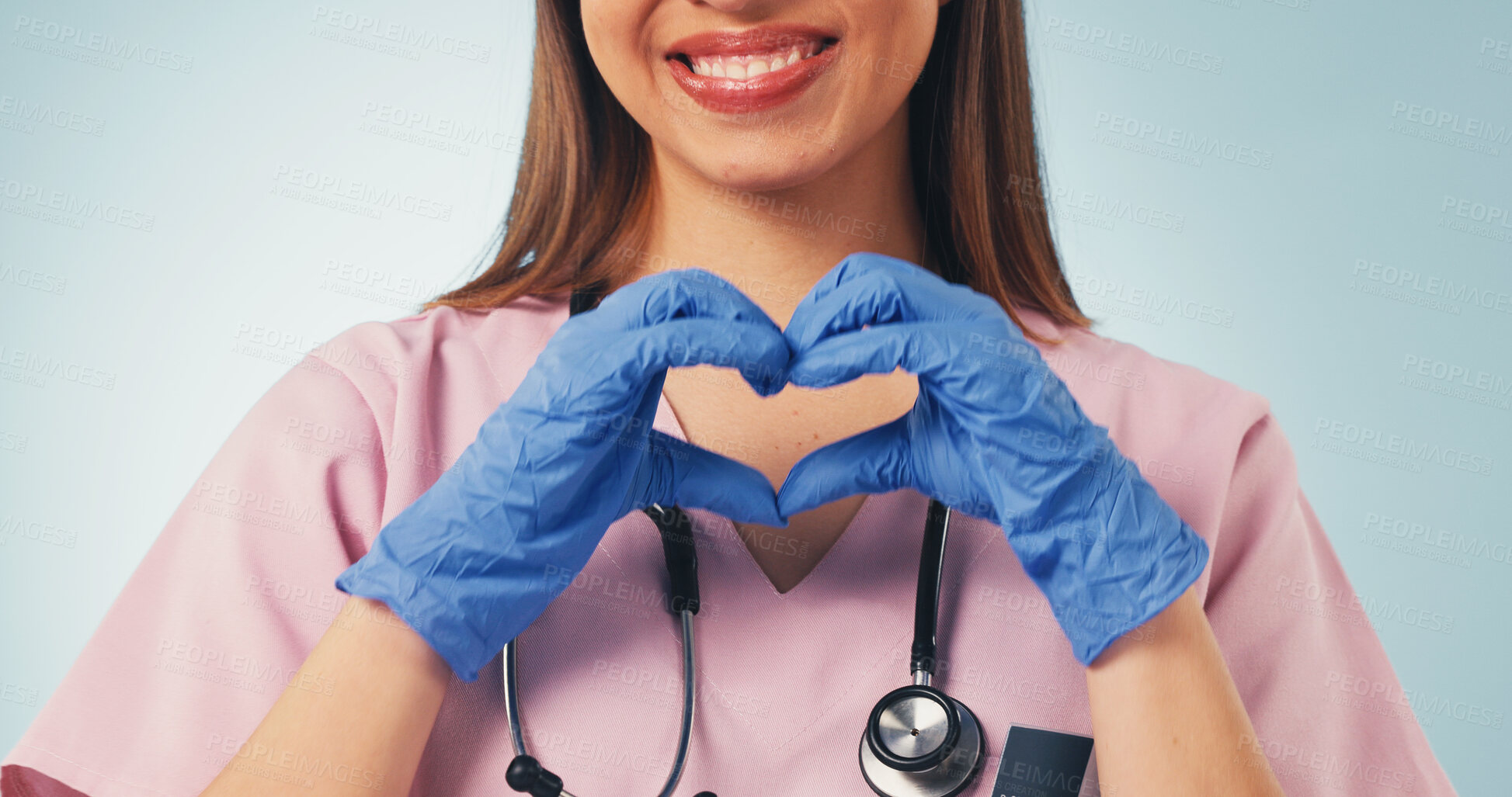 Buy stock photo Woman, doctor or happy with heart hands in health for medical support, pediatric care or trust. Pediatrician, person and gloves with love emoji on studio background for safety, integrity or assurance
