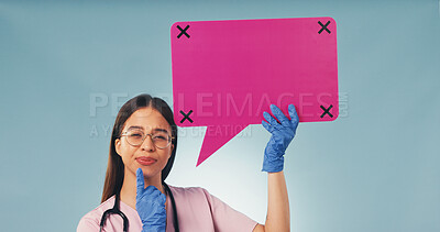 Buy stock photo Portrait, nurse and thinking in studio with speech bubble, woman and planning for medical decision. Healthcare worker, female person and poster for idea, social media and vision on blue background.