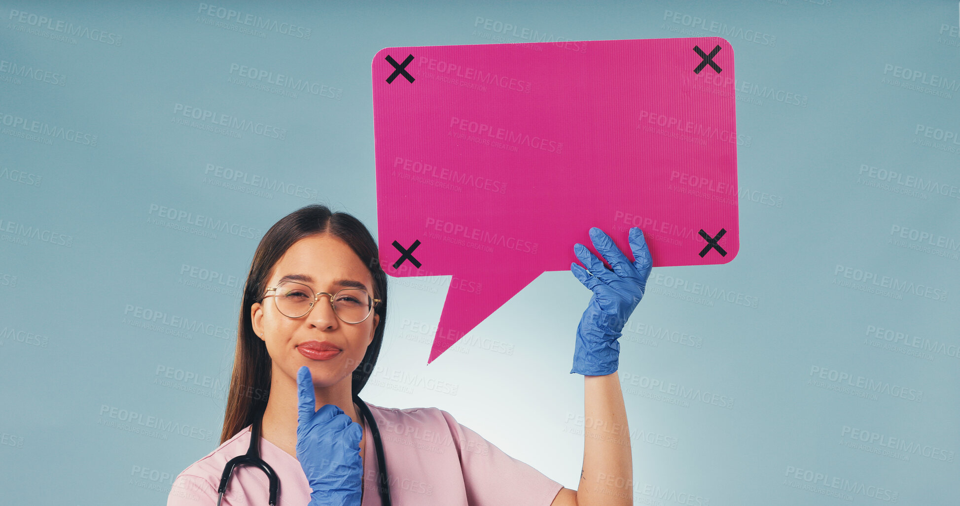 Buy stock photo Portrait, nurse and thinking in studio with speech bubble, woman and planning for medical decision. Healthcare worker, female person and poster for idea, social media and vision on blue background.