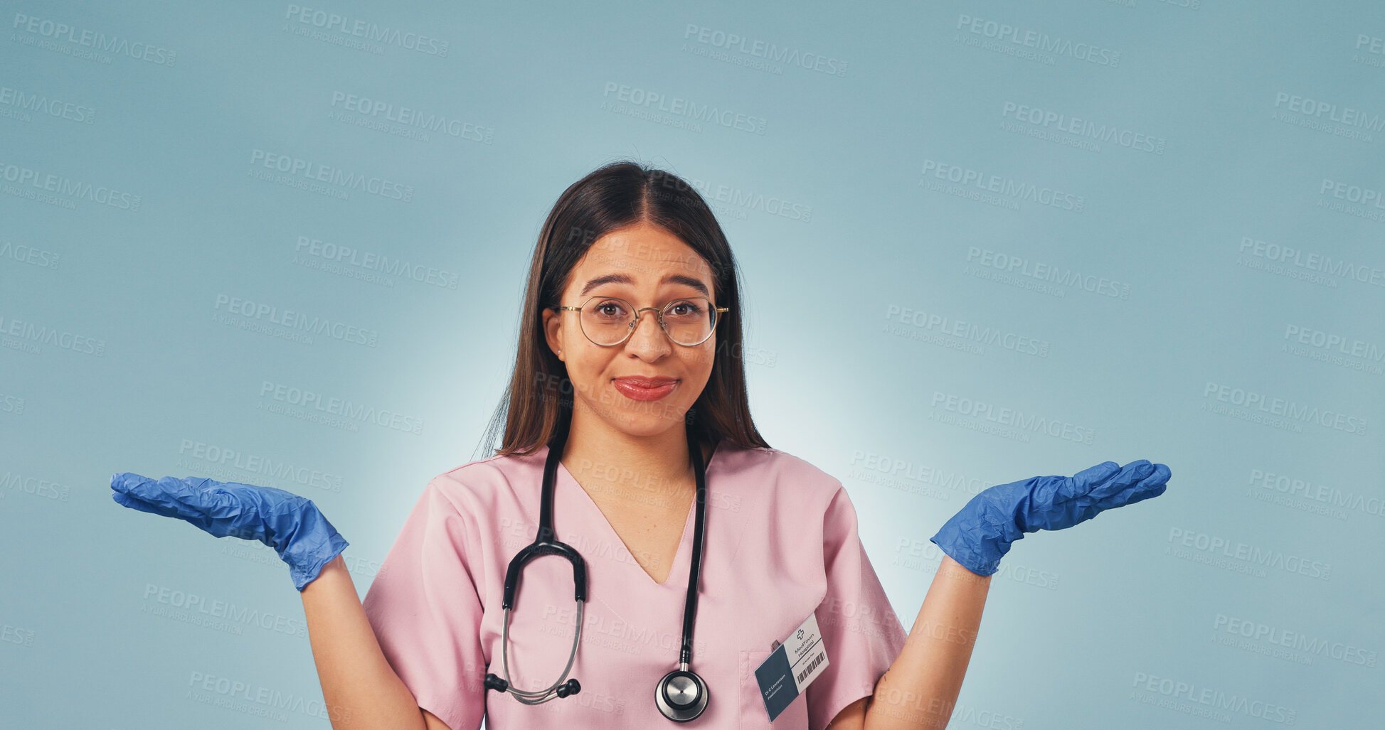Buy stock photo Nurse, shrug and portrait of woman in studio for confused, medical opinion and treatment option. Healthcare review, mockup space and comparison with person on blue background for decision and unsure