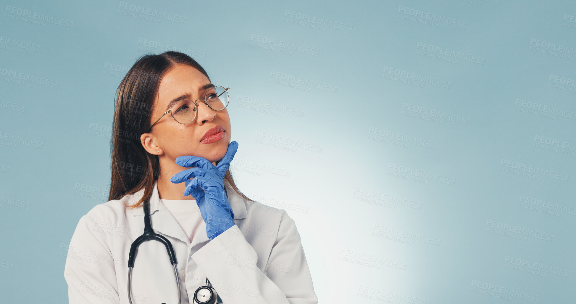 Buy stock photo Confused, woman or doctor thinking in studio with mockup space or plan for difficult medical decision. Healthcare worker, person and doubt for diagnosis, problem solving or concern on blue background