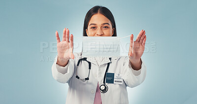 Buy stock photo Portrait, woman and doctor in studio with mask, advice and infection control for disease prevention. Healthcare worker, person and PPE for safety, medical regulations and protocol on blue background.