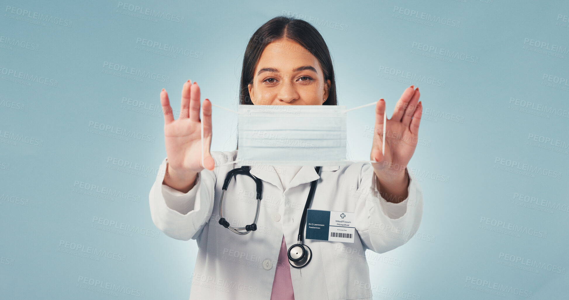 Buy stock photo Portrait, woman and doctor in studio with mask, advice and infection control for disease prevention. Healthcare worker, person and PPE for safety, medical regulations and protocol on blue background.