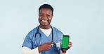 Nurse, portrait or black man pointing with phone green screen for advertising on a studio background. Male person, healthcare worker or showing smartphone display with smile for UI, UX or app review
