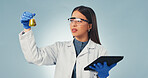 Science, liquid and woman on tablet in studio for chemistry, experiment fail and medical research. Pharmaceutical, tech and scientist with sample, observation and vaccine report on blue background