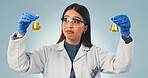 Science, liquid and woman in studio with decision, options or observation for chemical reaction. Pharmaceutical, thinking and person with sample, vaccine choice or medical research on blue background