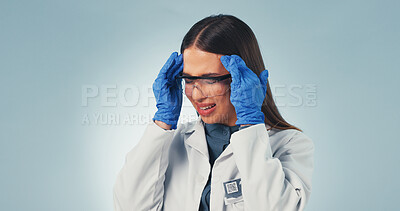 Buy stock photo Headache, science and woman in studio with stress, burnout and migraine for pharmaceutical mistake. Space, healthcare and person with head pain, strain and pressure for lab study on blue background