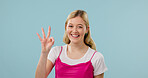 Portrait, sign language and smile of woman in studio for communication, counting or gesture. ASL, feedback and friendly with happy person on background space for answer, conversation or review