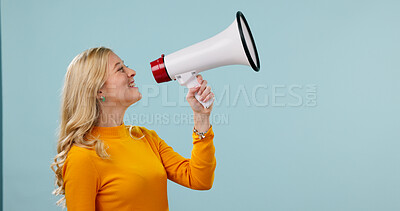 Buy stock photo Megaphone, space and woman in studio with news, announcement and info for retail sale. Happy, mockup and person with loudspeaker for communication, broadcast and voice for deal on blue background