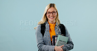 Buy stock photo College student, education and woman in studio with smile, science knowledge and mockup space. Learning, books and person with academic growth, biology scholarship or portrait on blue background
