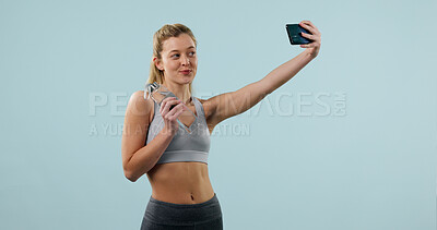 Buy stock photo Woman, water bottle and selfie in studio for fitness, influencer and social media for gym space. Person, memory or post with content creation for exercise club, confidence and drink on background
