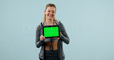 Buy stock photo Woman, portrait and tablet green screen in studio for advertising, gym app or technology. Info, display or person with fitness website, mockup space and happy with online announcement on background
