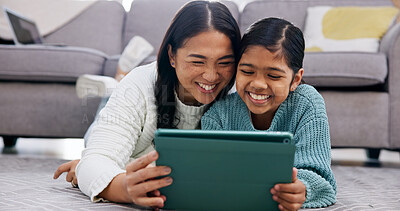 Buy stock photo Daughter, love and mother with tablet on floor in home living room for bonding or streaming. App, family and girl child with single parent woman in apartment for browsing, happiness or internet