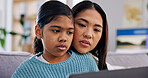 Laptop, learning and mother with daughter on sofa in home living room for bonding or growth. Computer, family and single parent woman teaching girl child in apartment for development or study