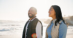 Love, smile and couple at beach for travel, trust or connection together on summer vacation. Man, woman and bonding with partner by ocean for happiness, relationship security or commitment on holiday