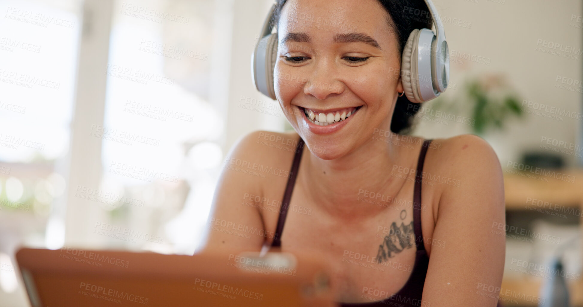 Buy stock photo Laugh, headphones and woman in home on tablet for internet, watching videos and podcast on weekend. Happy, relax and person on digital tech for website, streaming and listening to audio for break
