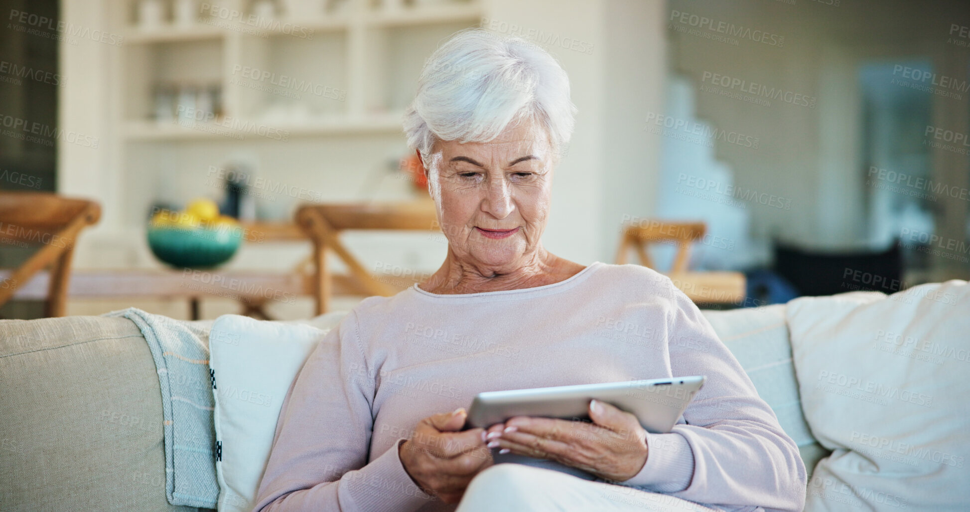 Buy stock photo Tablet, relax and senior woman in home on website for ebook, online article and check story. Tech, retirement and person chill on sofa at apartment for digital literature, browsing internet and info