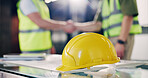 Helmet, architect or people with handshake for building safety agreement or deal in office. Employee, civil engineer or contractor shaking hands with hard hat for architecture security or partnership