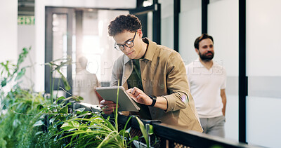 Buy stock photo Man, typing  and tablet in office with sustainable business, research or idea with ESG compliance. Person, agenda and online in eco friendly company with tech, review or audit for carbon footprint