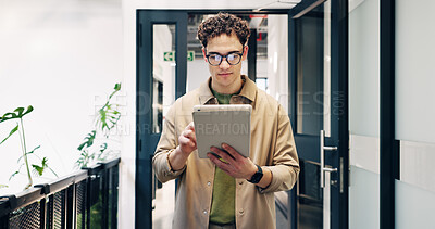 Buy stock photo Creative, man and research with tablet in office building for web design or project planning. Businessman, designer or employee with technology in corridor for business improvement or development