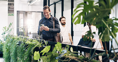 Buy stock photo Smile, phone and research with business man in office for reading, contact and sustainability email. Esg newsletter online csr report and communication with person in creative agency for post