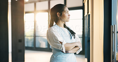 Buy stock photo Serious, realtor and businesswoman with arms crossed in building, think or plan for property listing. Real estate agent, reflection and person with decision for project, contemplating and remember