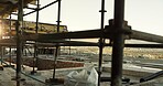 Building, scaffolding and construction site for structure, framework and architecture project. Exterior, design or rooftop at worksite for foundation, skeleton safety and development for upgrade