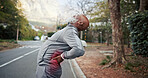 Black man, stretching and retirement with back pain for fitness, accident and sprain from exercise. Old person, discomfort and red glow outdoor with joint cramp, muscle injury and burnout from sports