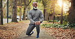 Fitness, earphones or old man outdoor with stretch, leg mobility or audio playlist in wellness activity. Digital, knee or black person with tech, warm up music or muscle improvement in senior hobby.